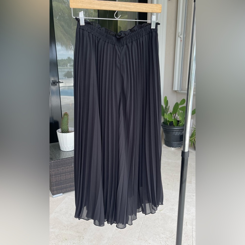 Pleated pants.
